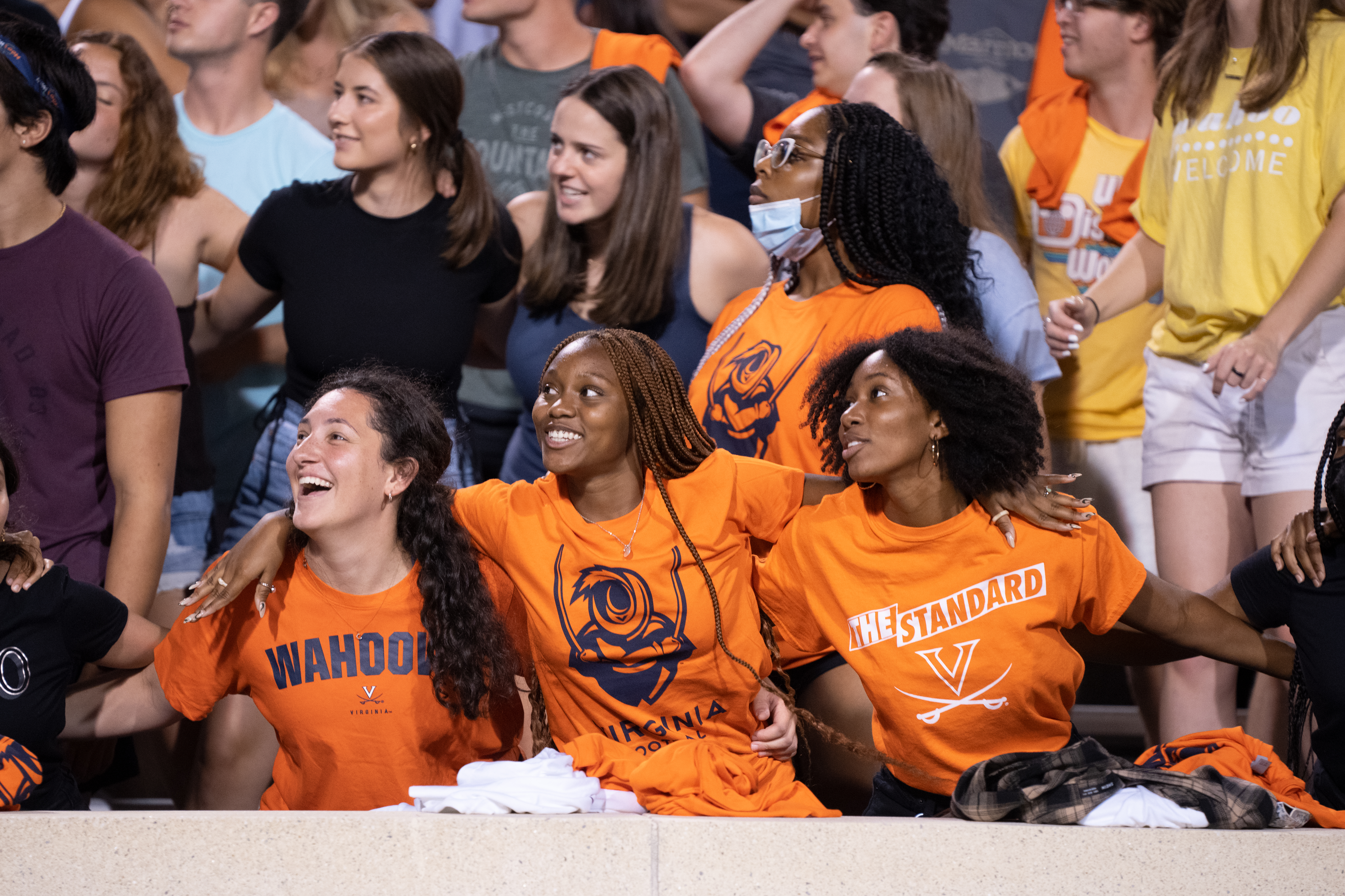 Students cheering at a UVA football game