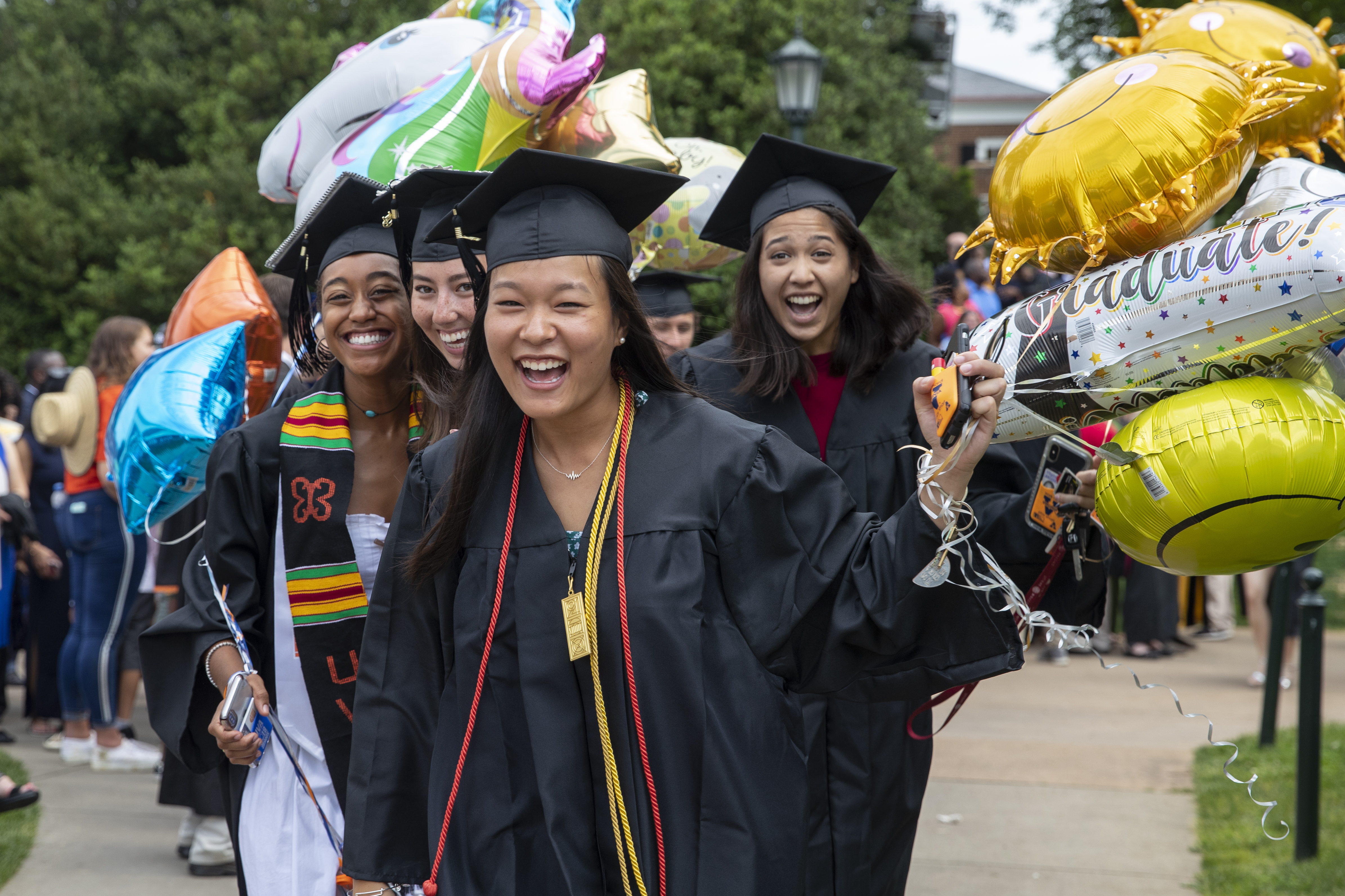 Students with balloons at Final Exercises